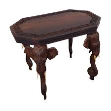 The base has fourteen legs separated by architecturally intriguing arches with carved honeycomb panels. Indian Rosewood Carved Side Or Coffee Table With Elephants In 2021 Carved Table Side Table Wood Solid Wood Side Table
