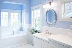 The brushed brass tub and sink fixtures and the brass pendant light all lending an air of luxury to the space. Blue Bathroom Traditional Bathroom Seattle By Paul Moon Design Houzz
