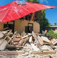 A family eats breakfast in front of homes destroyed by a 7.2 magnitude earthquake in les cayes, haiti, sunday, aug. L G4us9aaieum