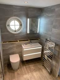Many modern bathrooms are now going for this look. Fully Tiled Bathroom With Feature Declan O Byrne Tiling Facebook