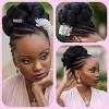 Center bun hairstyle for black women. 3