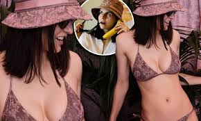Alexandra Daddario puts on a VERY busty display in a pink Dior bikini while  by pool at the Beverly Hills Hotel | Daily Mail Online