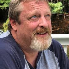 Checking out an "Assyrian angel" -- the winged figure to the left -- in the  Iraq Museum in Baghdad. Santha (Santha Hancock)and I have now completed  what we hope will be the