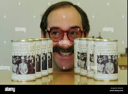 Jon Resnick of Milwaukee, a resident of Hong Kong, smiles in Hong Kong  Tuesday, May 27, 1997 between rows of "Canned Colonial Air," a novelty  souvenir item he and fellow expatriate, Guy
