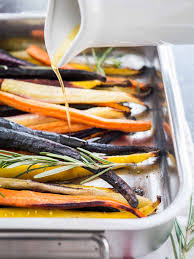 Baking dish coated with cooking spray. Brown Butter Maple Glazed Roasted Rainbow Carrots Plated Cravings
