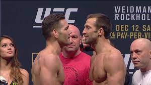 Luke rockhold beat chris weidman at ufc 194 by tko after brutal fight to claim middleweight title. Chris Weidman And Luke Rockhold Talk Trash During Their Staredown Youtube