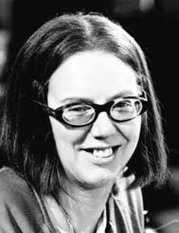 The late Anna Karen who played Olive in 'On the Buses' holding up the board  game based