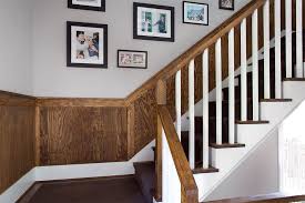 The staircase transitions into the landing, and turns left. How To Install Wainscoting Think Wood