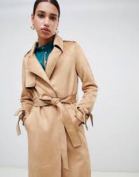 Not only is it the best way to give your exhausted black coat a rest, but the golden color makes every outfit feel a little more sophisticated and refined. River Island Faux Suede Belted Trench Coat In Camel Asos