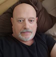 In November 1968, Mr Keightley catches a 3rd former carving his initials  into a lab desk An interview with Mr Glover is arranged.