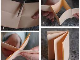 Fold the paper in half with a hamburger fold — in other words, your fold should make the paper shorter and fatter, not longer and skinnier. An Easy Tutorial For A Mini Booklet