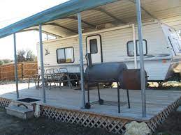 Using A Metal Carport For Camper And Deck Camper Living Rv Living Trailer Living