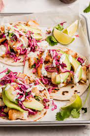 Serve fish over grilled tortillas with corn slaw and avocado. The Easiest Fish Tacos With Slaw Gluten Free Paleo Aip Unbound Wellness