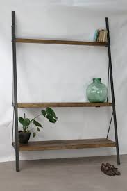 Made from pine wood, this durable ladder shelf features a metal x on the back of the unit for an extra design splash. Konk Industrial Ladder Bookcase Oak Steel Van Konkfurniture Op Etsy Ladder Bookcase Bookcase Handmade Furniture