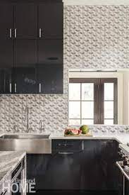 The lighter elements reflect light and the contrast adds definition and style to small kitchens, where space to display décor is at a premium. Galleries New England Home Magazine