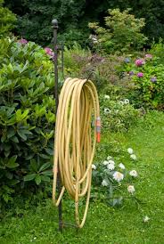 The suncast resin wicker hose pot is a decorative way to store your outside garden hose. 26 Different Types Of Garden Hose Storage Options