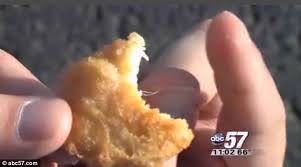 Like a real chicken nugget it is less than a mouthful, not satisfying by itself, and can be warmed up and finished off in less than 3 minutes. Fowl Discovery Woman Discovers White Feather In The Middle Of Her Mcdonald S Chicken Nugget Daily Mail Online