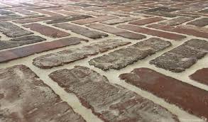 A Review Of Our Brick Flooring One Year Later Brick Tiles Brick Look Tile Brick Tile Floor