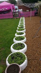 20 Diy Tire Planters That Will Catch Your Attention The Art In Life Garden Backyard Landscaping Tire Garden
