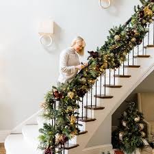 Hanging banister garland makes a beautiful additon to your christmas. Photos Hgtv