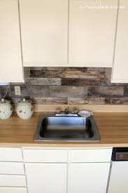 I have redone the floors by milling old heart pine beams from an 1840's cotton mill. Remodelaholic How To Install A Pallet Wood Back Splash