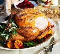 Christmas dinner consists of roast stuffed turkey and ham, mince pies, roast potatoes, brussels sprouts, and other vegetables. Christmas Dinner Recipes Bbc Good Food