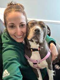 Calypso loves snuggling with anyone, including Denali