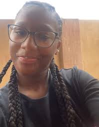 Woman in hospital gown walking in traffic