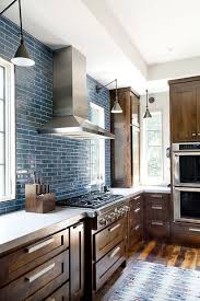 Kitchen With Rustic Wood Cabinetry And Blue Tile Solid Wood Kitchen Cabinets Wood Kitchen Cabinets Blue Backsplash Kitchen