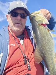 Kayak bass fishing with black and blue jig