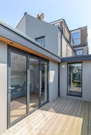 Modern Bi Fold Doors Floor To Ceiling Glazing Flat Roof Extension Painted Grey Render Flat Roof Overhang Wi Flat Roof House Flat Roof Design House Roof