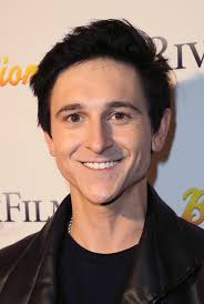 American actor, singer, and songwriter. He is best known for his three  Disney Channel roles as Oliver Oken in "Hannah Montana"; Jeremy Johnson in  the animated series "Phineas and Ferb"; and his