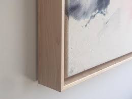 These metal frames provide a sleek look to any photo and creates a floating effect no matter where you place it. Canvas Float Natural Frame By Simply Framed