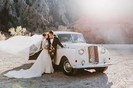 We are happy to collect from any location in kilkenny or nearby counties and deliver you happy and safe to your destination, for anything from weddings, birthday parties, graduations, hen nights etc. Bride And Groom In A Stunning Picture At Big Cottonwood Canyon With A Vintage White Bentley Vintage Weddi Vintage Car Wedding Wedding Car Giraffe Photography