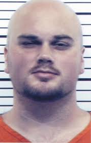 Inmate charged in slaying now in Scott County Jail