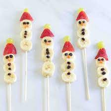 Grapes, strawberries, bananas, and marshmallows threaded on toothpicks. 24 Healthy Christmas Snacks Easy Holiday Snack Recipes 2019