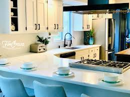 White tile kitchen backsplashes harmonize seamlessly with stainless steel appliances. Kitchen Makeover Funcycled