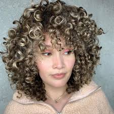 Short curly hair styles with taut and kinky tops come out dashing yet classy, especially accentuated with a curly hair fade. 50 Best Haircuts And Hairstyles For Short Curly Hair In 2020 Hair Adviser