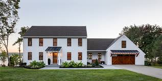 Carriage house doors on three car garage. Modern Farmhouse Makeover Lakefront Outdoor Living