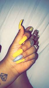 To show off your sassy style, you can't fail with these matte colored nails with an extended, square tip. Yellow Nails Acrylic Silver Glitter Brebraxkin On Insta Acrylic Nails Yellow Yellow Nails Yellow Nail Art