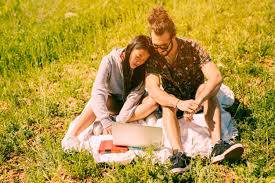 Madrid (conde duque, verdi) and barcelona (verdi). Free Photo Couple Sitting In Meadow And Looking Into Laptop