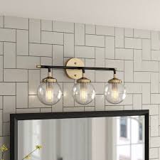 It has two cut glass shades that help diffuse the light from two 100w bulbs, which are sold separately. Shontelle 3 Light Dimmable Matte Black Antique Gold Vanity Light Mobler Mobler Og Interior Interior