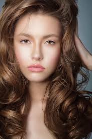 Sexy Woman with Long Windy Brown Hair and Saturated Makeup — Stock Photo ©  Gromovataya #52282887