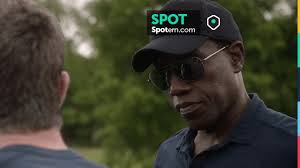 The baseball cap solid black worn by Isaac (Wesley Snipes) in Armed  Response
