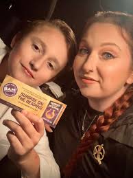 Can you help me identify a book with a lady in a white dress