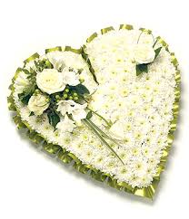 Funeral heart flower tributes at flower station. Funeral Cushions And Hearts