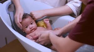 Your baby's bath should be 37 degrees c to 38 degrees c, which is around body temperature. Chinese Baby Bathing Stock Video Footage 4k And Hd Video Clips Shutterstock