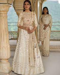 The collection is inspired from the union of red which symbolizes love and commitment with white which is a symbol of purity. Elegnat White Lehenga Designer Bridal Indian Indianbride Indianweddings Modern Desig Indian Wedding Outfits Indian Bridal Dress Indian Bridal Outfits