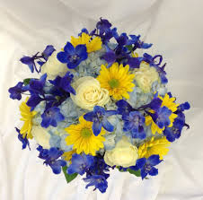 What kind of flowers are best for a blue wedding? Blue Yellow And White Bridal Bouquet With Delphinium Hydrangea Daisies And Roses By Nan Yellow Bridal Bouquets Spring Wedding Flowers Flower Bouquet Wedding