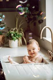 To get started, fill the baby bathtub or sink with just a couple of inches of warm water. My Baby In The Kitchen Sink Dreams Gemma G Photography Facebook